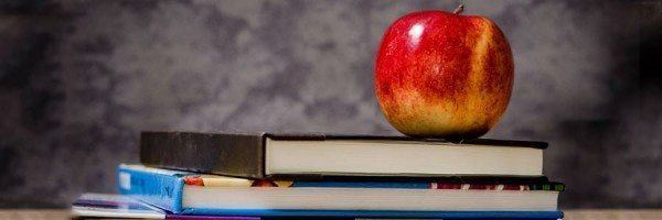 An apple and a stack of textbooks