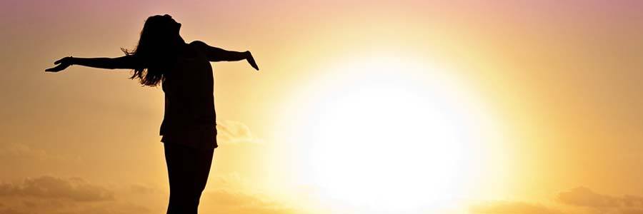 woman welcoming sunrise