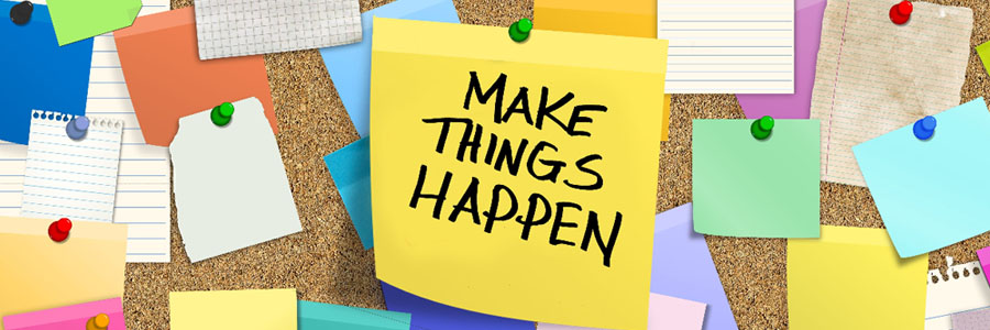 Cork board with a post it saying "make things happen"