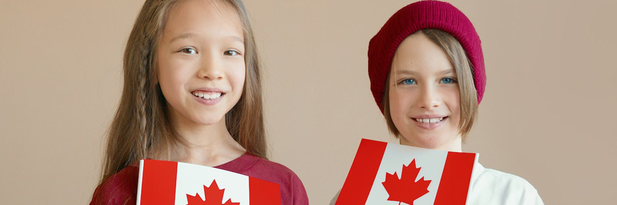 Two kids with Canadian flags