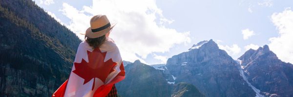 woman draped with Canadian flag